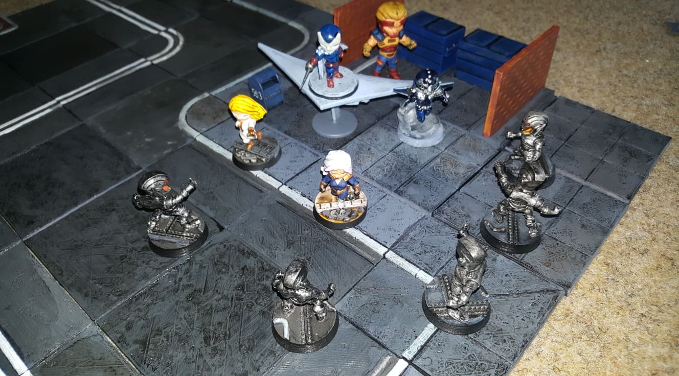 Painted heroes and machines fighting on an urban game board